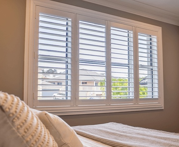 Plantation shutters in bedroom